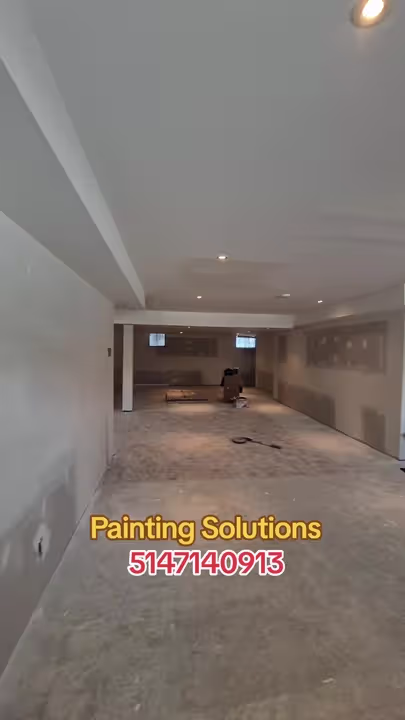 Chantier intérieur de Painting Solutions : sous-sol, murs et plafond en préparation.